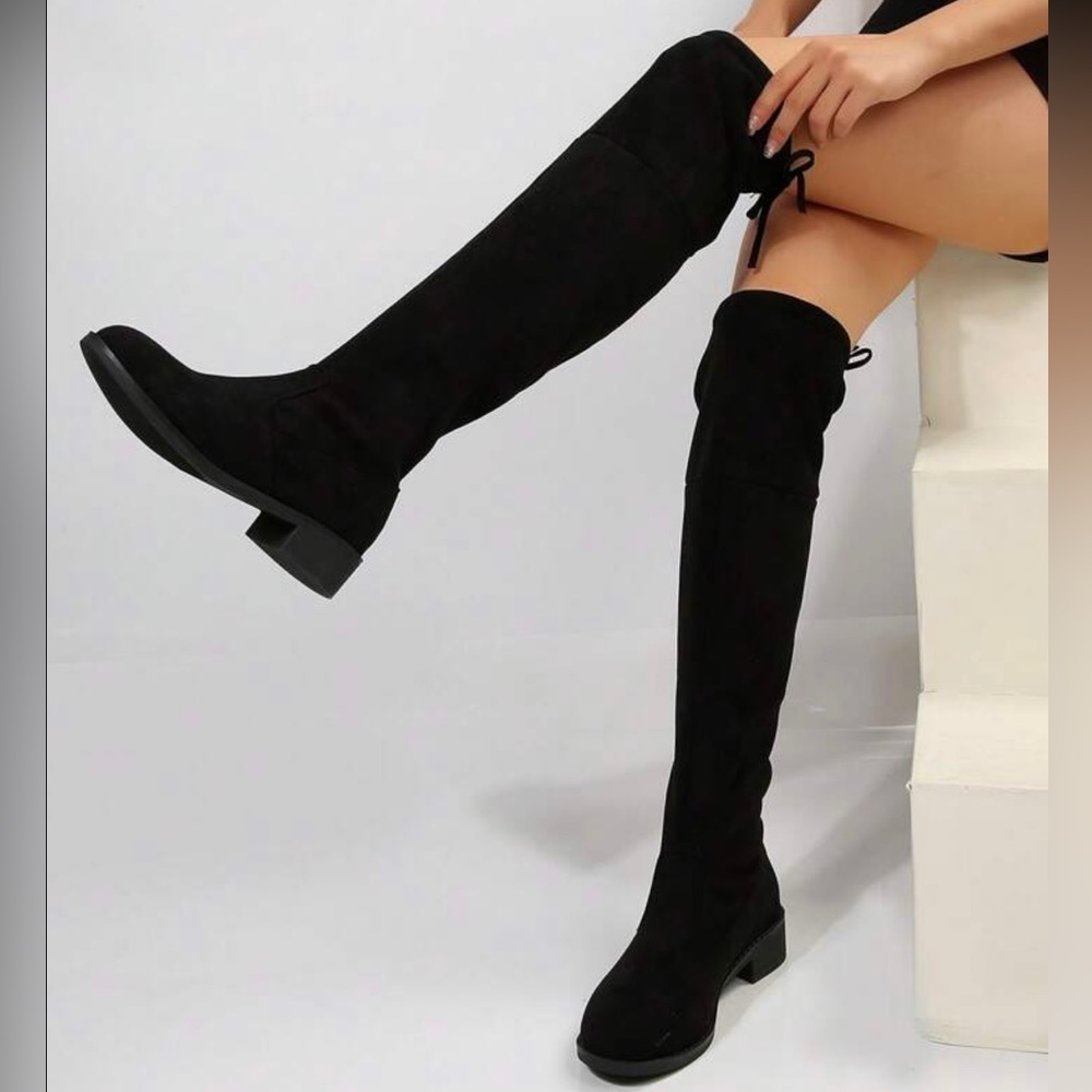 Over the knee boots in Matte Black
